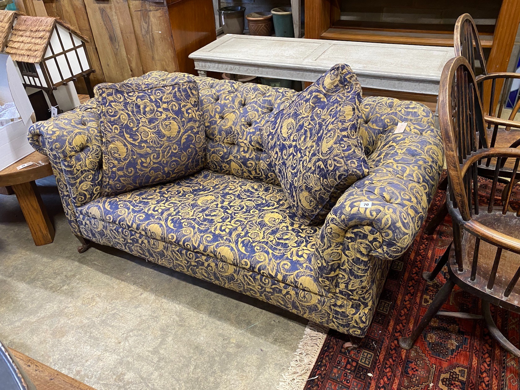 A late Victorian upholstered drop arm Chesterfield settee, length 166cm, depth 86cm, height 72cm